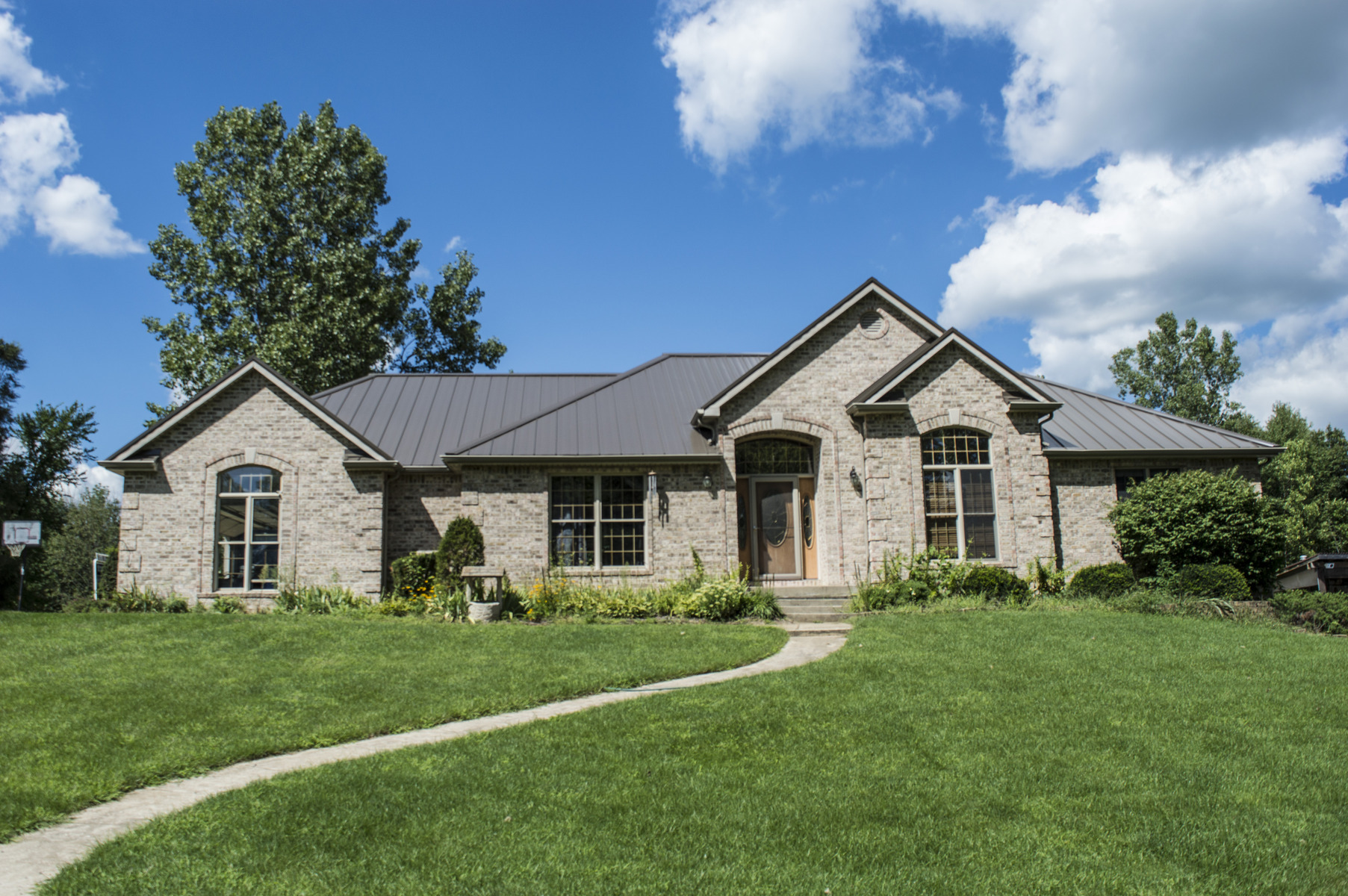 home with panel steel roofing