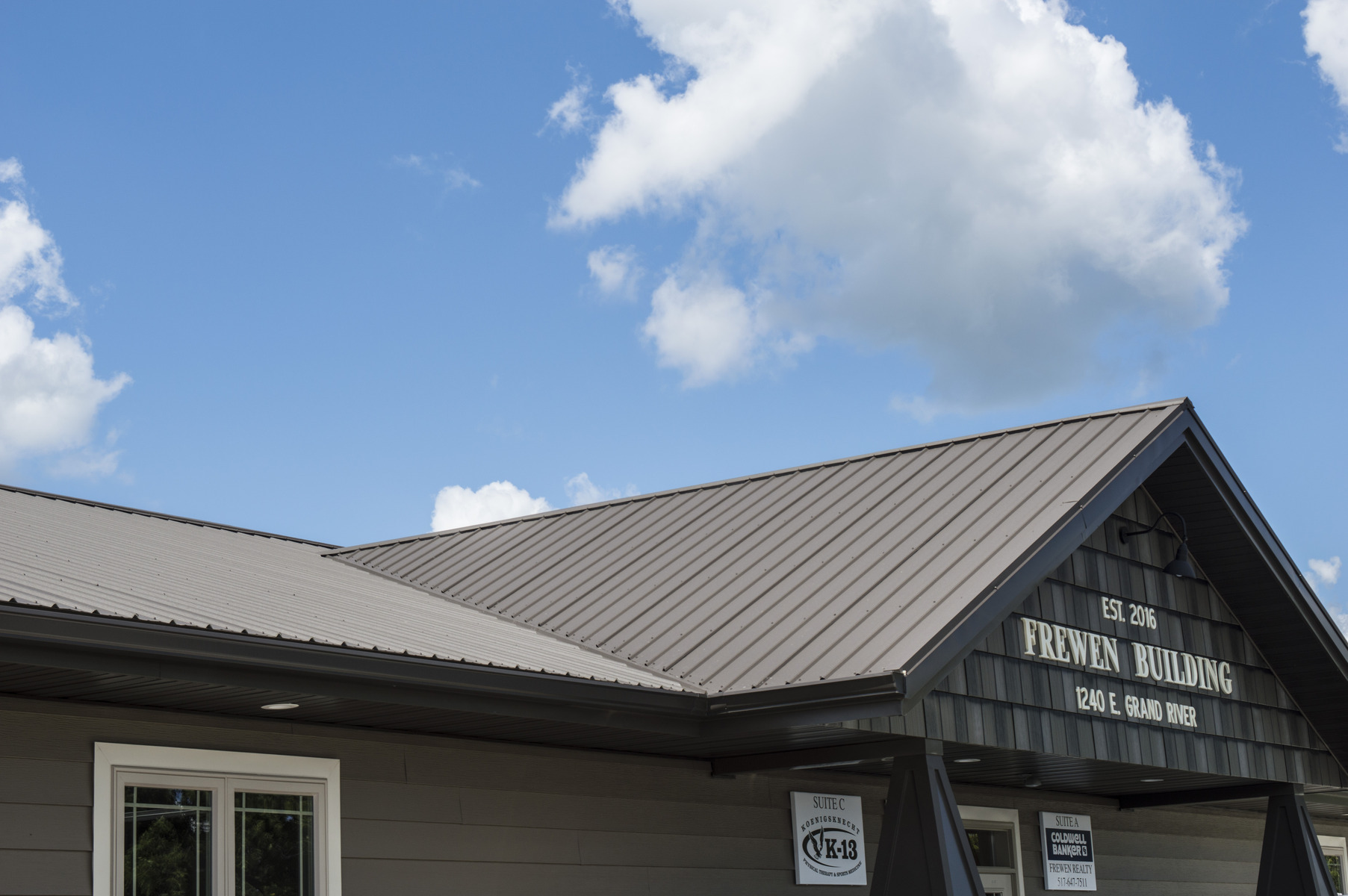 building with panel steel roof